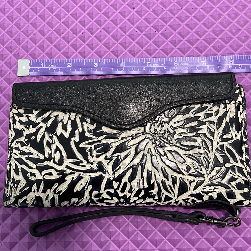 Patricia Nash black and white tooled leather wallet.